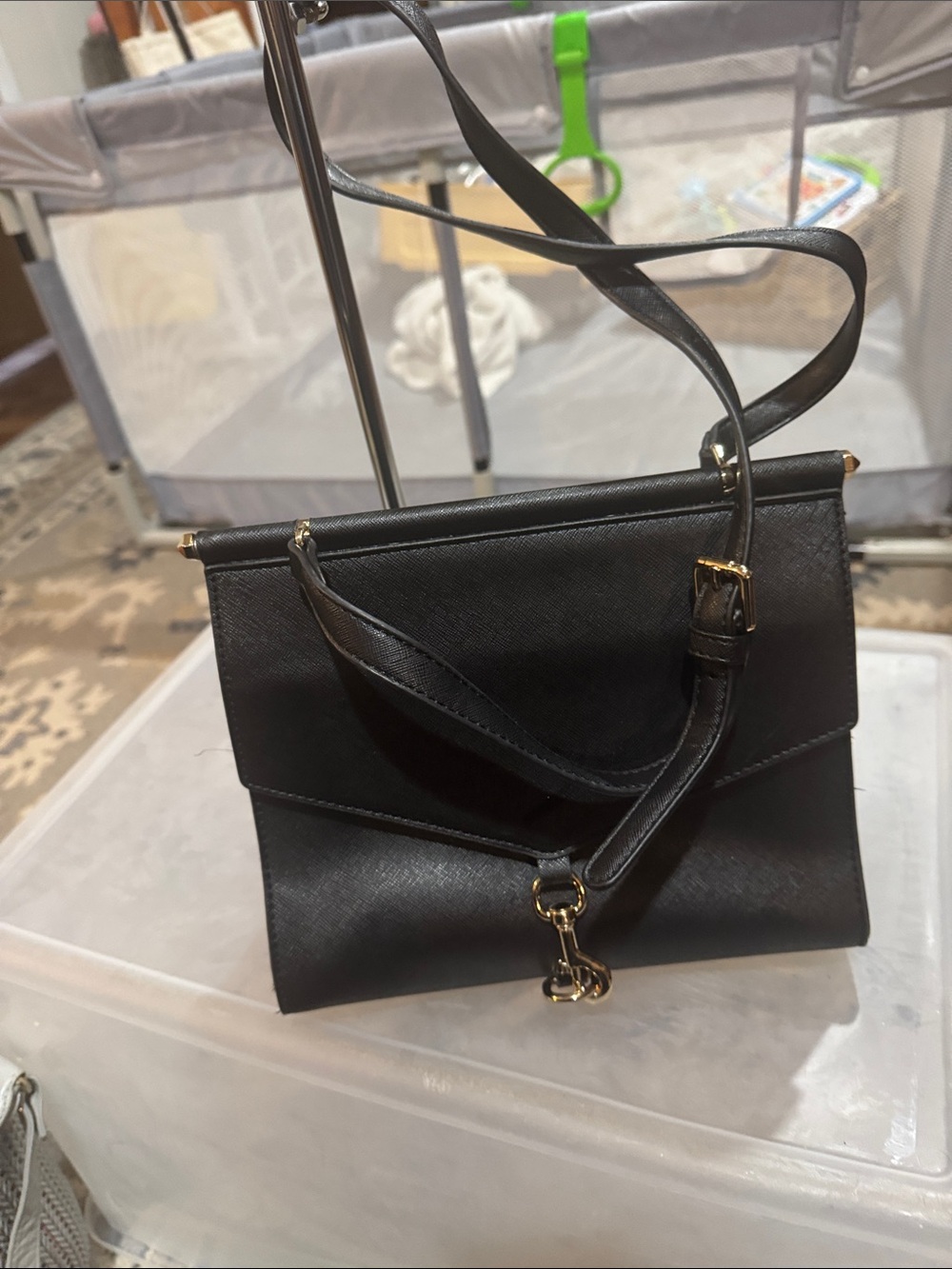 Sleek Black Crossbody Bag with Gold Hardware made with vegan leather,